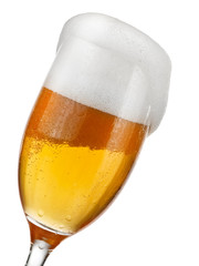 Glass with beer and foam, close up
