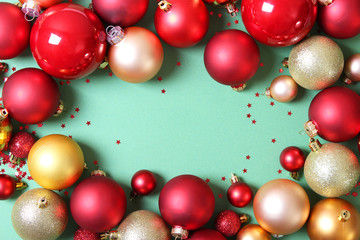 Decorative Christmas balls on a colored background top view. Place to insert text.