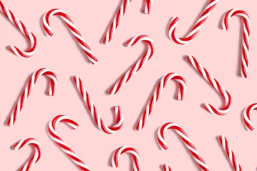 Rolgordijnen Candy cane for party design on pink background. © fotomaximum