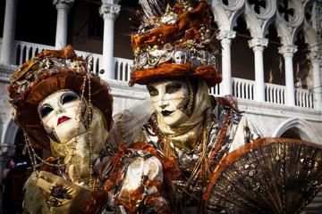Costumed couple on the Piazza San Marco during Venice Carnival.