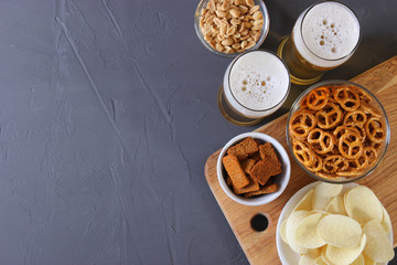 Beer and snacks on the table top view.