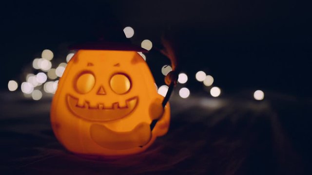 Close up Halloween pumpkins smile and scrary eyes with light bokeh background, 4k