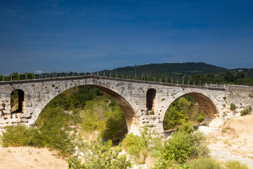 Fototapeta na wymiar Pont Julien, ancient Roman bridge, abbot, Provence, Provence-Alpes-Cote d'Azur region, France, Europe,