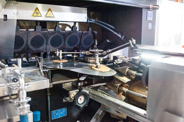 Fototapeta na wymiar Factory for the production of waffle cups for ice cream