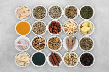 Asthma and respiratory relieving herbs, spice and supplement powders used in natural and chinese herbal medicine in porcelain bowls. Flat lay.