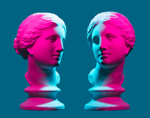 Statue neon. On a blue isolated background. Gypsum statue of Aphrodite's head.