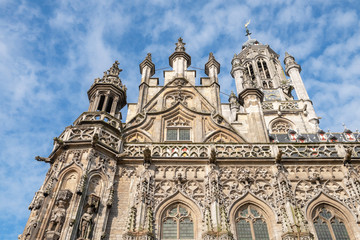 Fototapeta premium Side view of the beautiful Middelburg Town Hall against the sky, Netherlands