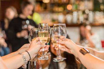 Women toasting with drinks
