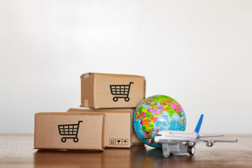 Boxes and plane with planet earth. Shopping worldwide concept