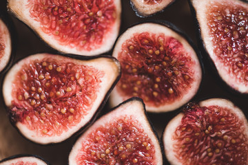 Fresh sliced figs on table closeup. Top view. Selective focus.