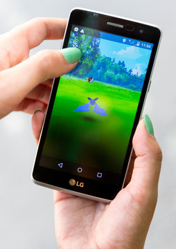 Pokemon Go game in a hand. Zubat