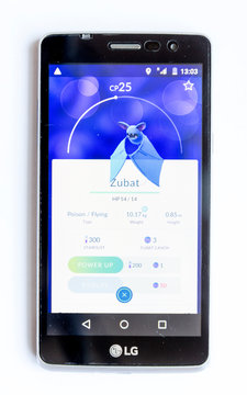 Sofia, Bulgaria - July 23, 2016: A mobile phone showing on screen Pokemon Go augmented reality mobile game isolated on a white background. Zubat.