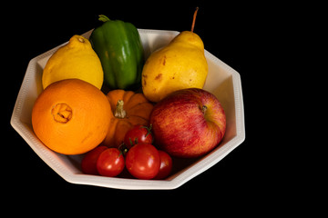 fruits in a bowl on granite
