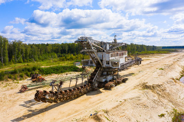 old rusty multi bucket excavator, giant stacker, absetzer in sandy career