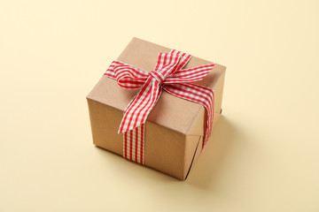 Gift box with bow on color background, space for text