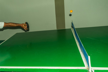 man hand playing ping pong