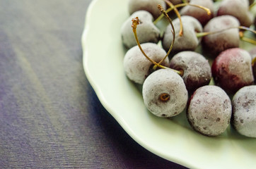 cherry berries cherries frozen by frost on a bright background