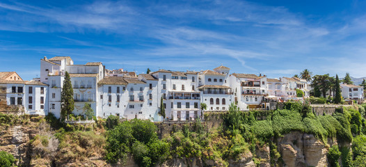 Panorama of white houses at the canyon in historic city Ronda, Spain