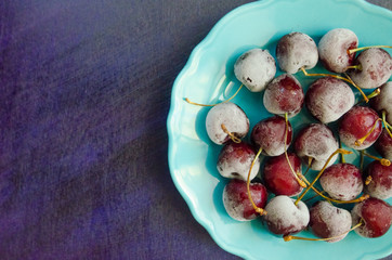 cherry berries cherries frozen by frost on a bright background