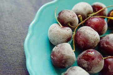 cherry berries cherries frozen by frost on a bright background