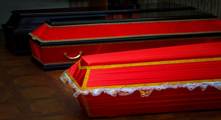 Coffins, funerals, burial of man.