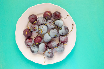 cherry berries cherries frozen by frost on a bright background