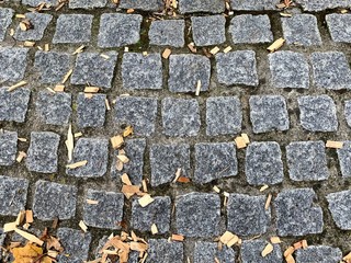 Array of stones shaping the platform with small wooden pieces above the stones.