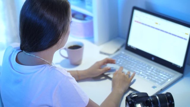Woman working on a laptop at home