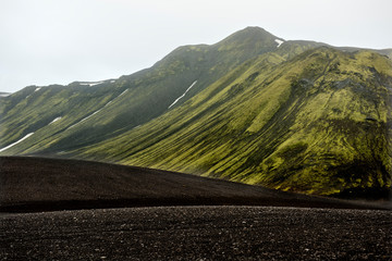 Moss covered black volcanic mountains near Langisjor Iceland