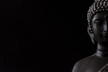 buddha statue on black background