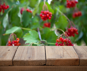 .image of wooden table in front of abstract blurred background of
