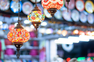 Multi-colored lamps in the eastern bazaar. Shop of oriental souvenirs.