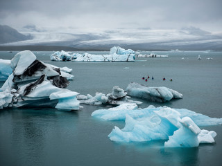 Kayakers among the iceburgs near Jokulson Glacier