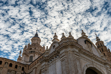 Exterior view of Tarazona Cathedral (Spain) with a dramatic sky of clouds.