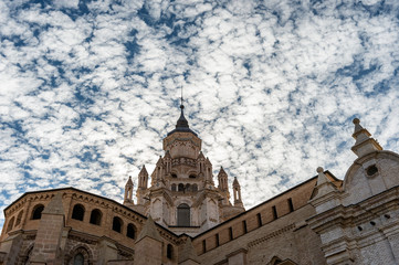 Fototapeta premium Exterior view of Tarazona Cathedral (Spain) with a dramatic sky of clouds.