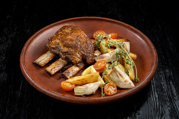 Ethically raised, fresh cut organic rib eye steak grilled with fried potatoes.