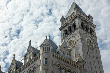 Fototapeta na wymiar Old Post Office Pavilion, Historic 1899 building, Washington, DC, USA. Cloudscape sky background