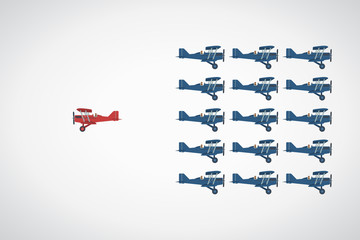 Think differently concept. Be different. Red airplane changing direction. New idea, change, trend, courage, creative solution, innovation and unique way concept.