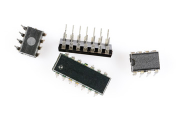 Electronic components. Four old microchips different types and sizes. Macro studio shot of...