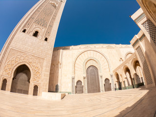 Fototapeta na wymiar Hassan II Mosque on coast of Atlantic Ocean in Casablanca Morocco. Biggest mosque in Africa. Beautiful Arabic African Architecture. 