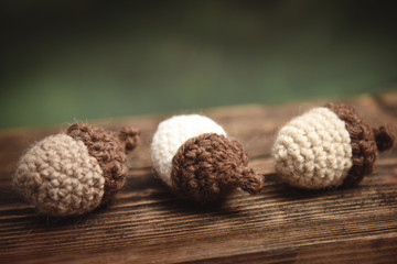 Crochet acorn decoration on a wooden table
