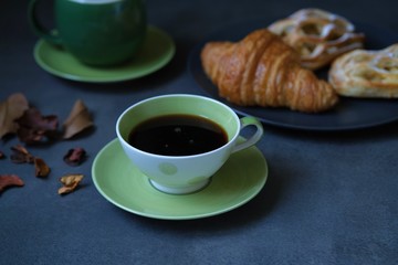 cup of coffee and fresh croissants