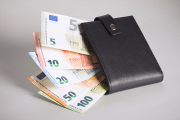 euro banknotes in black purse