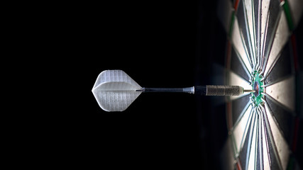 one dart in the center of a dartboard