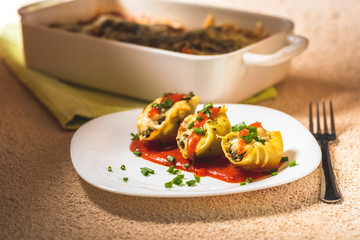 shell-shaped pasta stuffed with spinach and cheese