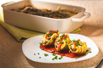 shell-shaped pasta stuffed with spinach and cheese