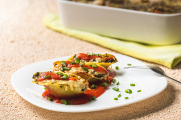 shell-shaped pasta stuffed with spinach and cheese