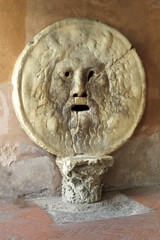 Closeup of the Bocca della Verità relief, a famous marble mask in Rome, Italy, Europe