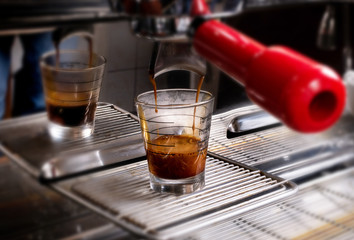 Making coffee in espresso shot in coffeeshop or cafe closeup