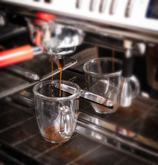 Making espresso coffee in coffeeshop or cafe closeup